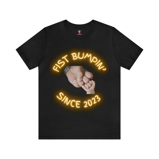 Gold Baby Fist Bumpin Since 2023 Unisex Jersey Short Sleeve Tee